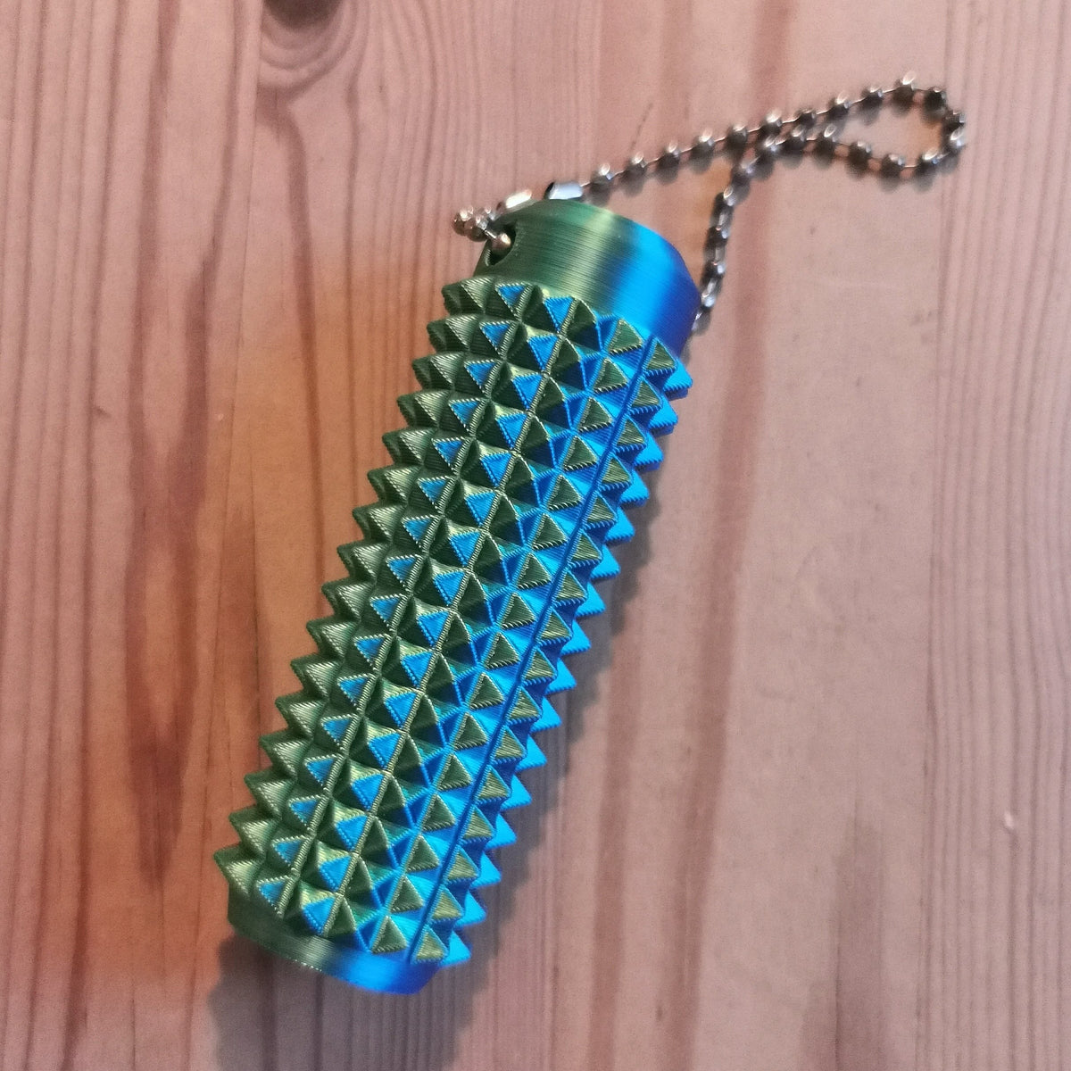 Piikkifidget sinivihreä liukuvärjätty