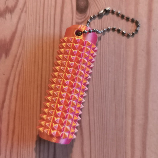 Piikkifidget kulta-punainen liukuvärjätty